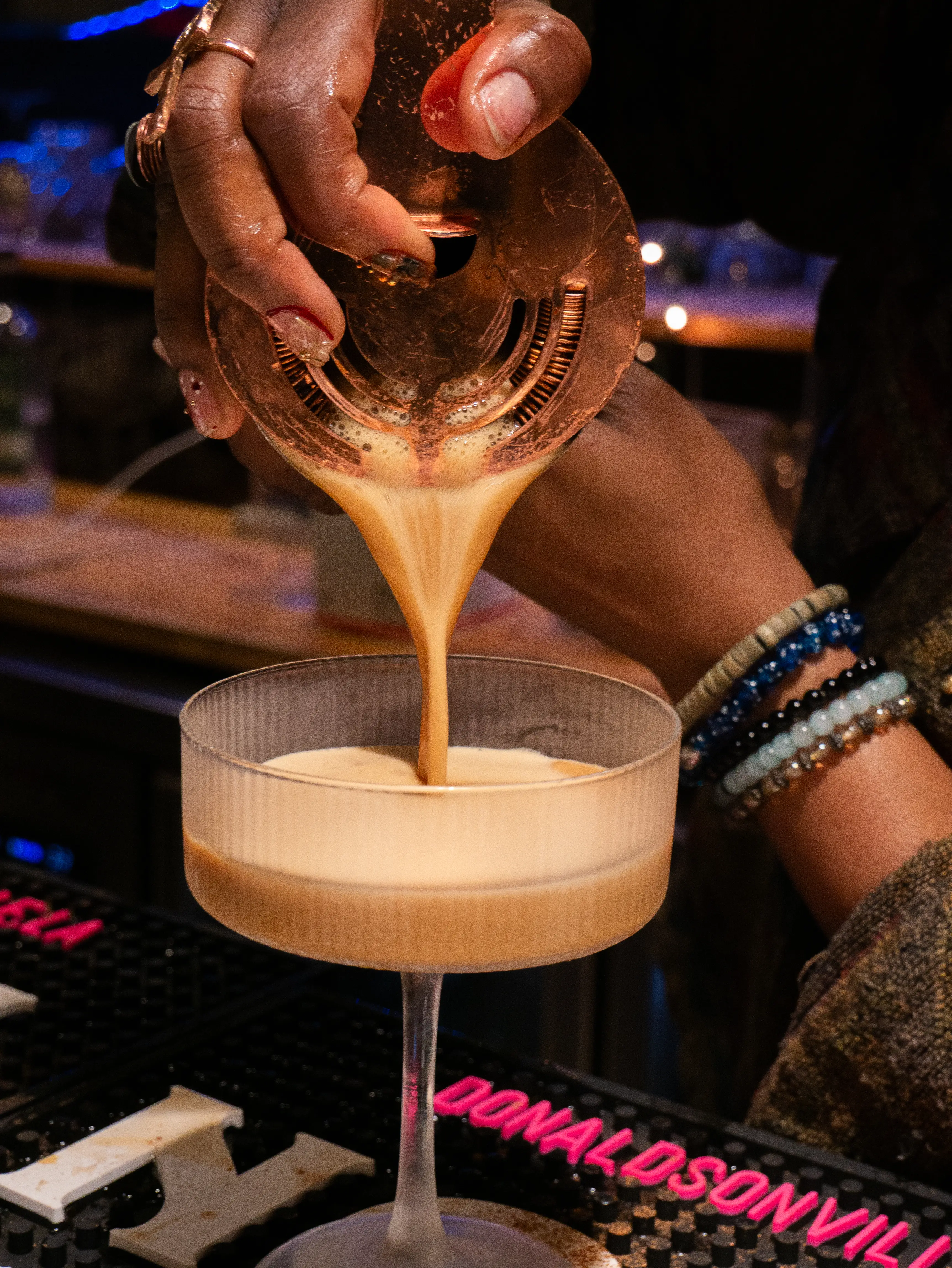 Cocktail pour captured in low light